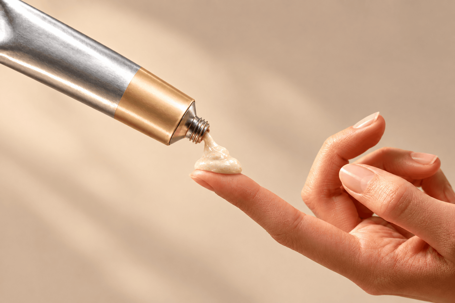 Dabbing the White Hazel Dream tube onto a fingertip